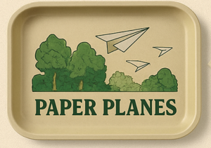The Ouid Store Paper Planes rolling tray, tan with green tree and paper airplane graphic